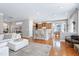 Spacious open-concept living area with a breakfast bar, hardwood floors, and ample seating at 11129 Bayberry Hills Dr, Raleigh, NC 27617