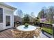 The backyard deck has a table and four chairs for outdoor dining and entertaining in a private backyard at 11129 Bayberry Hills Dr, Raleigh, NC 27617