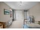 Bright bedroom with carpet, double closet, and a window with natural light at 1208 Briarcliff Rd, Burlington, NC 27215