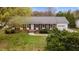 Charming brick home featuring mature landscaping and a welcoming front entrance at 1208 Briarcliff Rd, Burlington, NC 27215