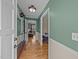 Inviting home hallway showcasing hardwood floors and neutral paint at 1208 Briarcliff Rd, Burlington, NC 27215