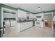 Spacious kitchen featuring white cabinets and stainless steel appliances at 1208 Briarcliff Rd, Burlington, NC 27215