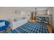 Cozy living room features a stylish daybed, decor, and decorative blue rug at 1208 Briarcliff Rd, Burlington, NC 27215