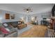 Open living room featuring hardwood floors and a comfortable seating arrangement at 1208 Briarcliff Rd, Burlington, NC 27215