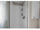 Enclosed shower offering tiled walls and shelves at 1208 Briarcliff Rd, Burlington, NC 27215
