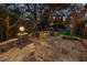 This backyard features a fire pit, patio, and seating for outdoor entertaining at 121 Highclere Ln, Cary, NC 27518