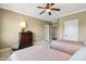 Comfortable bedroom featuring hardwood furniture, and plenty of natural light at 121 Highclere Ln, Cary, NC 27518