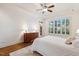 Bedroom with white walls, light carpet, a window, and a ceiling fan at 121 Highclere Ln, Cary, NC 27518