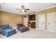 Bonus room with seating, a built-in bar, and neutral walls at 121 Highclere Ln, Cary, NC 27518