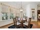 Cozy breakfast nook area with hardwood floors, natural light, designer lighting and a large window view at 121 Highclere Ln, Cary, NC 27518