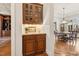 Butler's pantry with cabinets, countertop, and view into the dining room for entertaining at 121 Highclere Ln, Cary, NC 27518