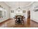 Bright dining room with hardwood floors, natural light, and modern chandelier at 121 Highclere Ln, Cary, NC 27518