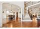 Formal dining room with hardwood floors, wainscoting, and elegant chandelier at 121 Highclere Ln, Cary, NC 27518