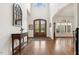 Grand foyer with soaring ceilings, hardwood floors, and double front doors at 121 Highclere Ln, Cary, NC 27518
