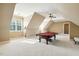 Large game room with a pool table and bright light at 121 Highclere Ln, Cary, NC 27518