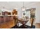 Open-concept kitchen with wood cabinets, modern appliances, breakfast nook, and seamless access to the living room at 121 Highclere Ln, Cary, NC 27518