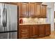 Kitchen featuring stainless steel appliances, wood cabinetry, and granite countertops at 121 Highclere Ln, Cary, NC 27518
