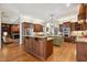 A spacious kitchen featuring dual islands, stainless steel appliances and custom wood cabinets at 121 Highclere Ln, Cary, NC 27518