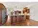Large kitchen featuring a center island, stainless steel refrigerator, and custom cabinets at 121 Highclere Ln, Cary, NC 27518
