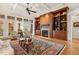 Inviting living room boasts built-in shelving, fireplace, coffered ceilings, and French doors to the exterior at 121 Highclere Ln, Cary, NC 27518