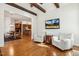 Open-concept living room with hardwood floors, and access to the gourmet kitchen, and casual dining area at 121 Highclere Ln, Cary, NC 27518