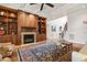 Cozy living room showcases a fireplace, built-in shelving, hardwood floors, and coffered ceilings at 121 Highclere Ln, Cary, NC 27518