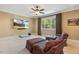 Media room featuring comfortable seating, a large screen TV, and a window for natural light at 121 Highclere Ln, Cary, NC 27518