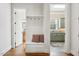 Hallway featuring a convenient mudroom area, with a bench, storage, and easy access to other rooms at 121 Highclere Ln, Cary, NC 27518