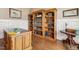 Well-appointed office with custom bookshelves, wainscoting, hardwood floors, and stylish decor at 121 Highclere Ln, Cary, NC 27518