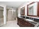 Spacious bathroom featuring double vanity sinks, granite countertop and a walk in shower at 124 Ripley Ct, Cary, NC 27513