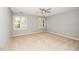 Spacious bedroom featuring neutral tones, ceiling fan and bright light from the window at 124 Ripley Ct, Cary, NC 27513