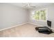 Bright bedroom featuring neutral walls, beige carpet, and a window with a wooded view at 124 Ripley Ct, Cary, NC 27513