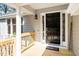 Welcoming front door with sidelights and a wooden porch, creating a warm and inviting entrance at 124 Ripley Ct, Cary, NC 27513