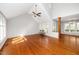 Spacious living room showcasing hardwood floors, high ceilings, and expansive windows at 124 Ripley Ct, Cary, NC 27513