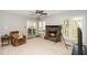 Cozy living room with a fireplace, neutral tones and a leather chair for relaxing near the TV at 124 Ripley Ct, Cary, NC 27513