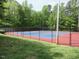 A red and blue tennis court offers a dedicated recreation area for community residents at 124 Ripley Ct, Cary, NC 27513