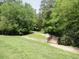 A walking trail with a bridge crossing makes a picturesque recreation area for the community at 124 Ripley Ct, Cary, NC 27513