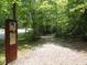 A gravel community walking trail is lined with dense mature foliage and trees at 124 Ripley Ct, Cary, NC 27513