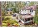 Aerial view showcases the home, shed, backyard, and surrounding greenery at 1308 Helmsdale Dr, Cary, NC 27511