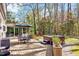 Relax in the spacious backyard featuring a deck, hot tub, and mature landscaping at 1308 Helmsdale Dr, Cary, NC 27511