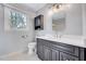 Bathroom featuring a white vanity, light fixture, and a toilet at 1308 Helmsdale Dr, Cary, NC 27511