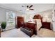 Spacious bedroom features a ceiling fan, windows, and furniture at 1308 Helmsdale Dr, Cary, NC 27511