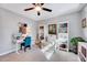Bedroom featuring desk, chair, built-in bookcase, and a fan at 1308 Helmsdale Dr, Cary, NC 27511