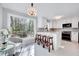 Bright kitchen boasts a large window, white cabinetry, and a breakfast bar with seating at 1308 Helmsdale Dr, Cary, NC 27511