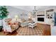 Cozy living room with a fireplace, built-in shelves, and hardwood floors at 1308 Helmsdale Dr, Cary, NC 27511