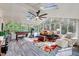 Bright sunroom features skylights, hardwood floors, and ample space for recreation and relaxation at 1308 Helmsdale Dr, Cary, NC 27511
