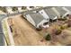 Backyard of home featuring siding, and partial view of screened-in patio with grill at 1404 Palmer Hill Dr, Durham, NC 27703