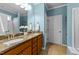 Bathroom featuring double sinks with granite countertop and vanity at 1404 Palmer Hill Dr, Durham, NC 27703
