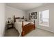 Charming bedroom featuring a bed and window at 1404 Palmer Hill Dr, Durham, NC 27703