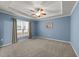 Spacious bedroom with tray ceiling and large window at 1404 Palmer Hill Dr, Durham, NC 27703
